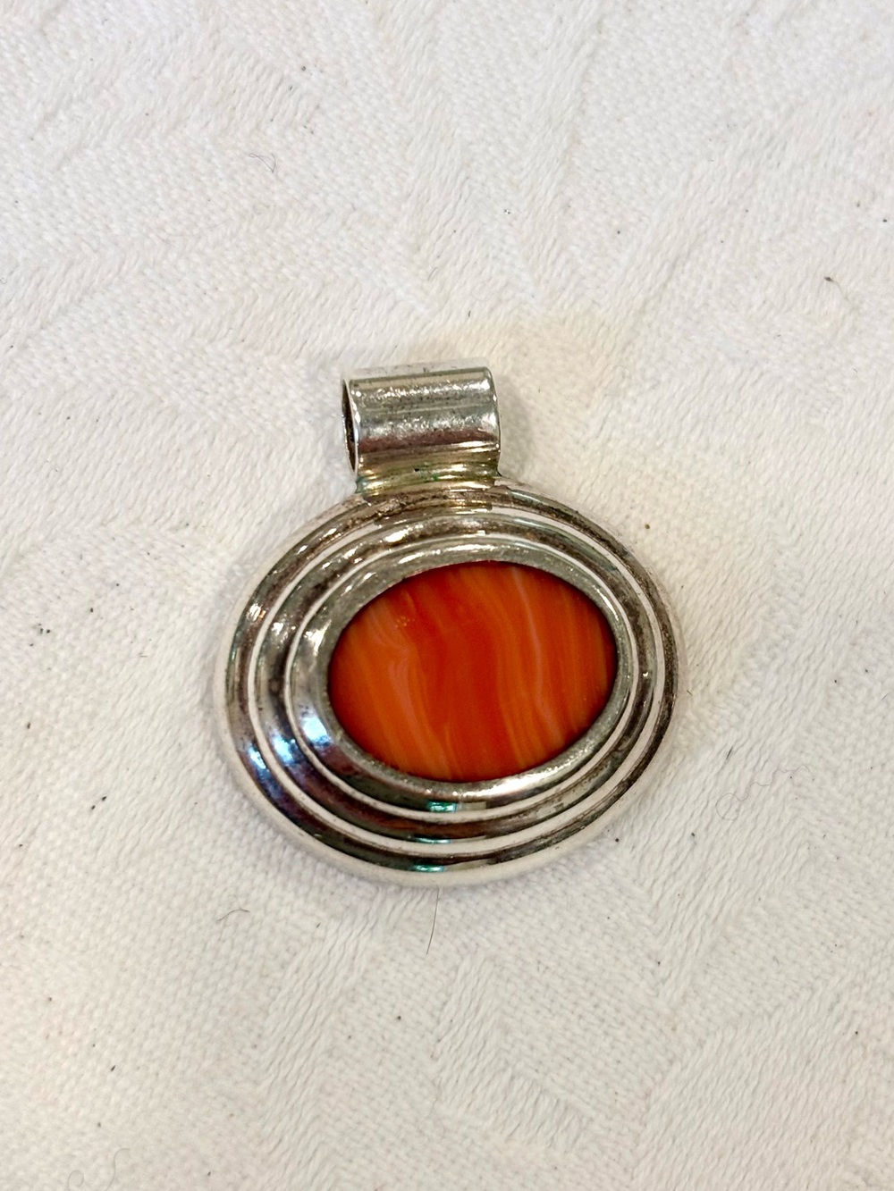 Sterling Silver Oval Pendant with Salmon Colored Stone